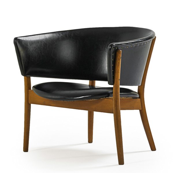 NANNA AND JORGEN DITZEL Chair: NANNA DITZEL (1923 - 2005) JORGEN DITZEL (1921 - 1961) KNUD WILLADSEN Lounge chair, Denmark, 1952; Beech, vinyl, brass studs; Stamped frame; 25 1/2" x 28" x 24" Note: From the first year of production