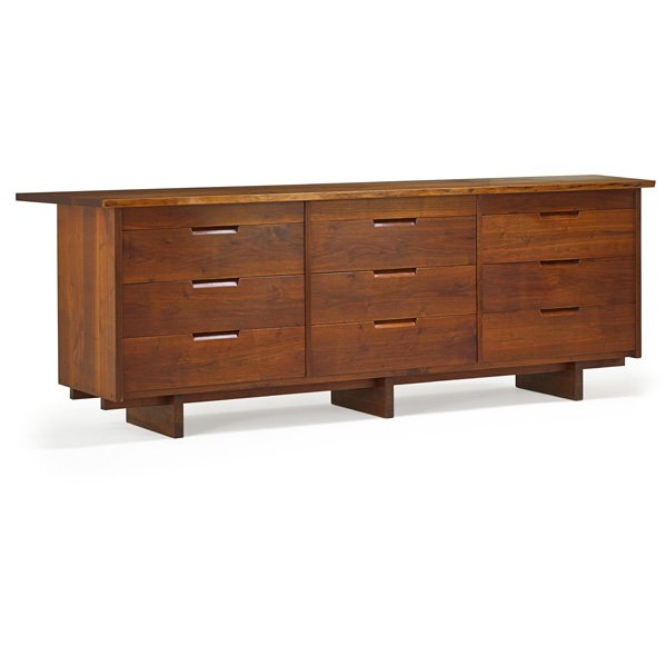 GEORGE NAKASHIMA Triple dresser: GEORGE NAKASHIMA (1905 - 1990) NAKASHIMA STUDIOS Walnut Triple Dresser, New Hope, PA, 1963; Signed with client's name to underside and back; 32" x 96" x 21 1/2' Provenance available: Copy of original 