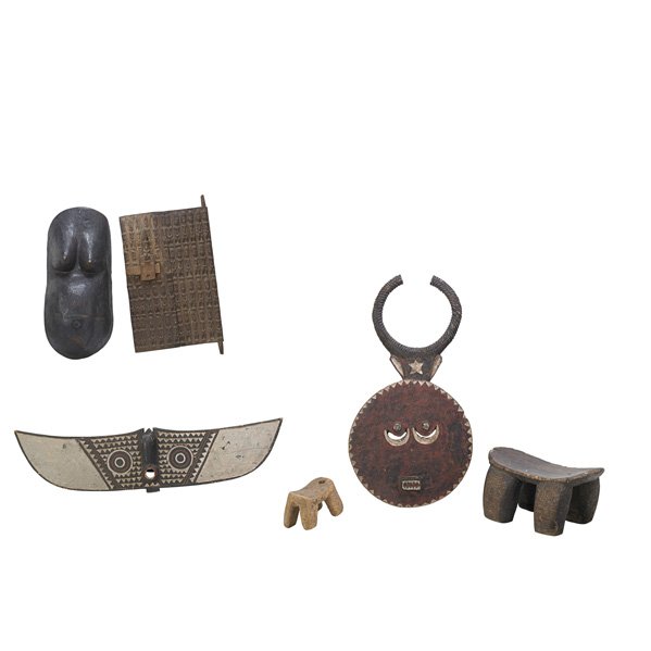 AFRICAN ITEMS: Six, 20th c.: Dogon door, breast plate, two stools, etc.; Longest: 43 1/2"