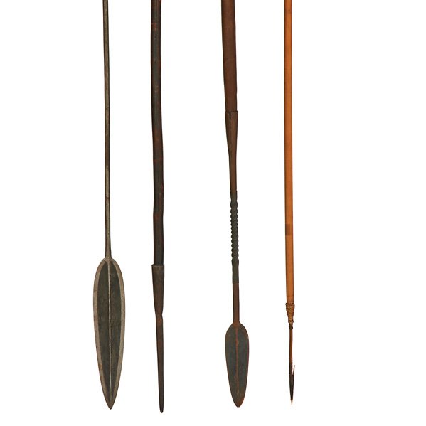 AFRICAN OR TRIBAL WEAPONS: Twenty items include sword with engraved and pierced decoration, boar spears, arrows, etc., 20th c.; Longest: 79"