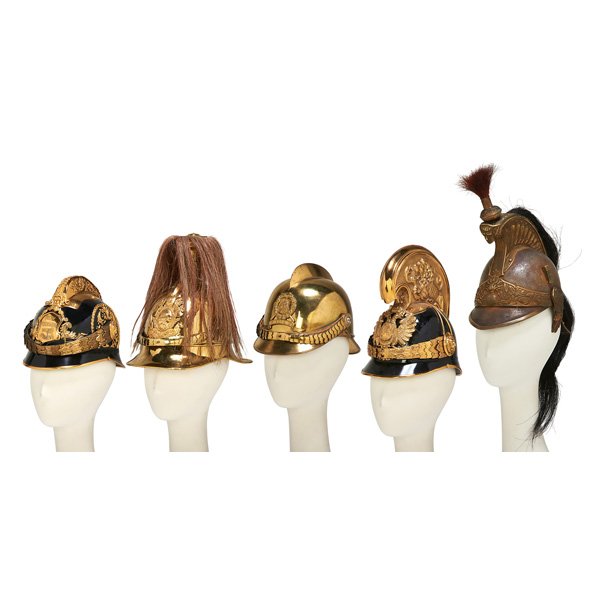 EUROPEAN WWI IMPERIAL HELMETS: Five, late 19th/early 20th c.: Austrian Dragoons, French Cuirassier and three firemen's helmets; Most restored with replaced components; Tallest: 11"