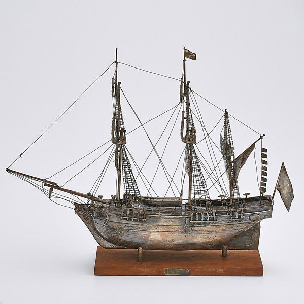 SILVER SHIP REPLICA HMS BOUNTY: Rigged with furled sails, on wood base; Unmarked; 12" x 15 3/4"