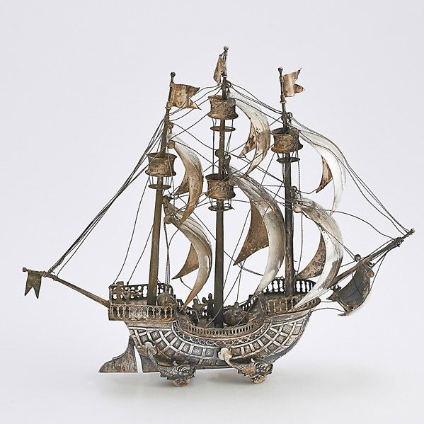 LUDWIG NERESHEIMER 800 SILVER NEF: Designed as a wheeled galleon with billowing sails inhabited by four sailors, dolphin-form hubs, deck detaches to expose bowl, on wheels, ca. 1890; 12 1/2" x 14â€; 32 OT