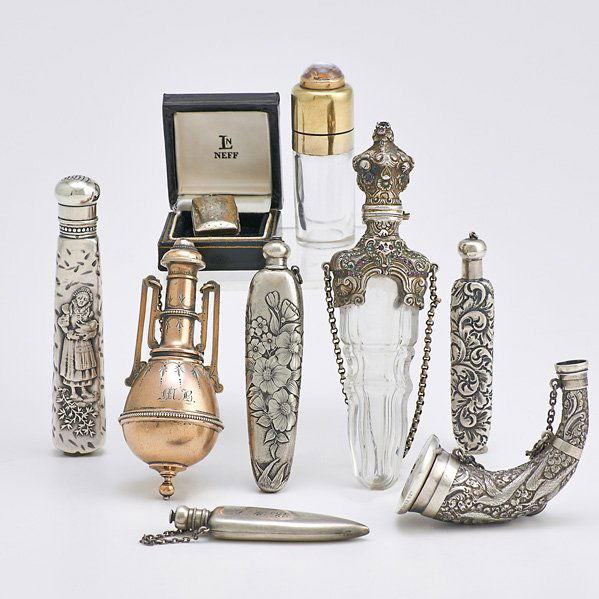 NINE SILVER SCENT FLASKS OR VINAIGRETTES: Jeweled rococo chased silver-mounted crystal, 5 15/16"; Hunt motif embossed powder horn vinaigrette, Thomas Johnson, London, 1870; Book form vinaigrette, Francis Clark, Birmingham, 1833; Urn-shaped vi