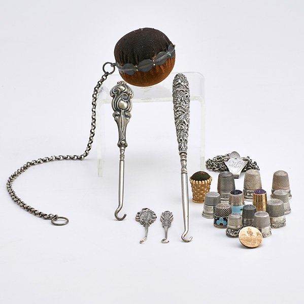 SILVER SEWING ACCESSORIES: Seventeen pieces; four sterling button hooks, largest 8"; Twelve thimbles depicting Paris Exhibition, 1889, The Liberty Bell, Lyon Exhibition, Columbian World Exhibition, Exhibition 1889, two depictin