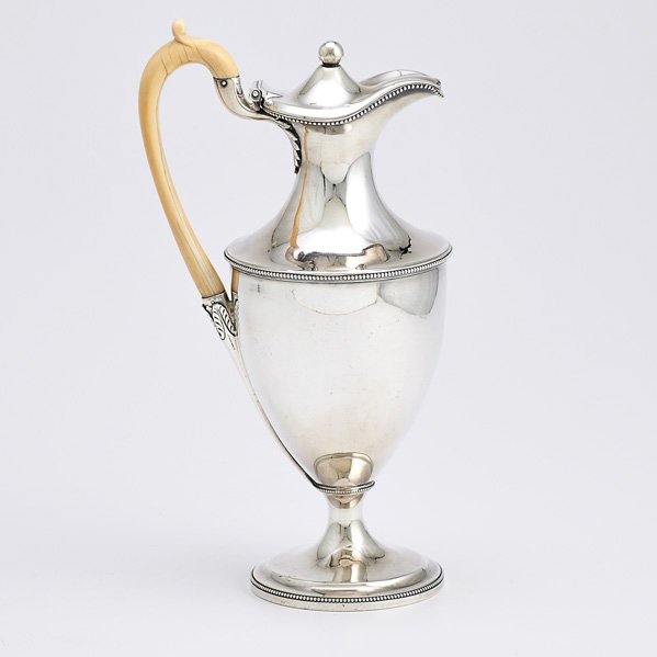 GEORGE III STERLING LIDDED EWER: Urn form, hinged lid, ball final, applied bead bands, ivory handle with leaf junctures, London 1789; Maker mark for Thomas Ollivant; 11 3/4"; 24.79 OT