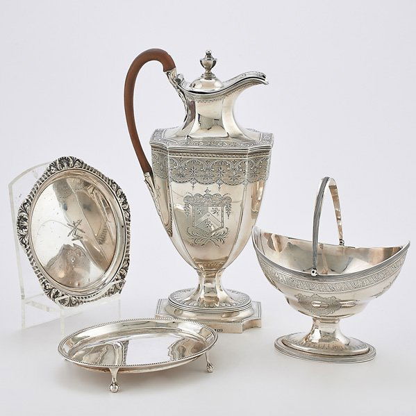 FOUR PIECES OF GEORGIAN SILVER HOLLOWARE: Wine ewer bright cut decorations and armorial cartouche, Adams style, hinged lid, wooden handle, London 1793, 12â€; Handled basket, Peter and Ann Bateman, London, 1792, 7 1/2â€ over handle; Oval