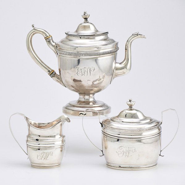 AMERICAN COIN SILVER COFFEE SERVICE BY TWO MAKERS: Three pieces; coffee pot on ring foot with ivory insulators, Brown & Seal, Philadelphia, ca. 1810, 9 1/2" over finial; Covered sugar bowl, 6 1/2" over final and cream pitcher, 5 1/4", J. Shoemaker, Ph