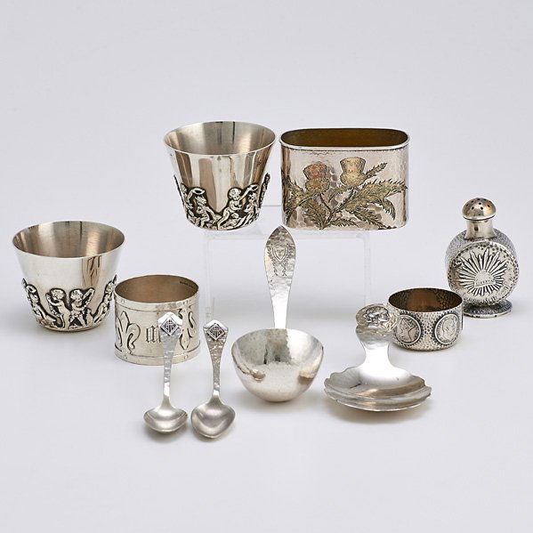 HOMERIC, ARTS AND CRAFTS AND OTHER AMERICAN SILVER: Ten pieces; Tiffany & Co. "Sagamore" flask mount with bicolored gold patinated etched decorations; Duhme & Co. "Homeric" caddy spoon; Shreve "14th Century" pattern napkin ring; Two coffee spoons, Jos.