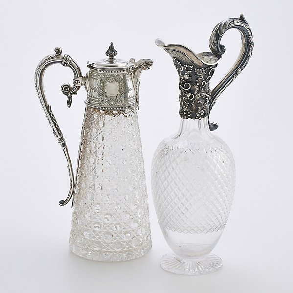 AMERICAN & ENGLISH CUT CRYSTAL/SILVER WINE SERVERS: American coin silver mounted brilliant cut wine jug in the Anglo-Irish form, herm spout, Neoclassical collar and handle, pierced plate, unmarked, 11 3/4"; English baluster-shaped cut glass wine pitche