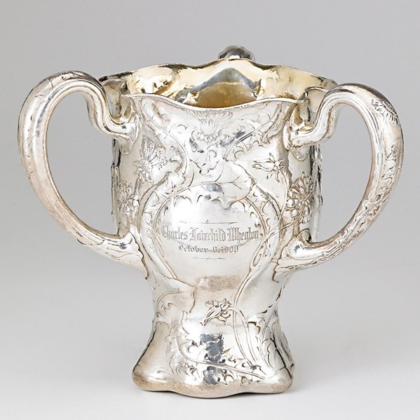 GORHAM MARTELE .9584 SILVER LOVING CUP: Three handled vessel with undulating rim, gilt interior, 1905, made by Frank Herotek, Inscribed to Charles F. Wheaton from Caroline T. Wheaton; 8 7/8" high x 10" across handles; 56.34 OT Note: 51 hour