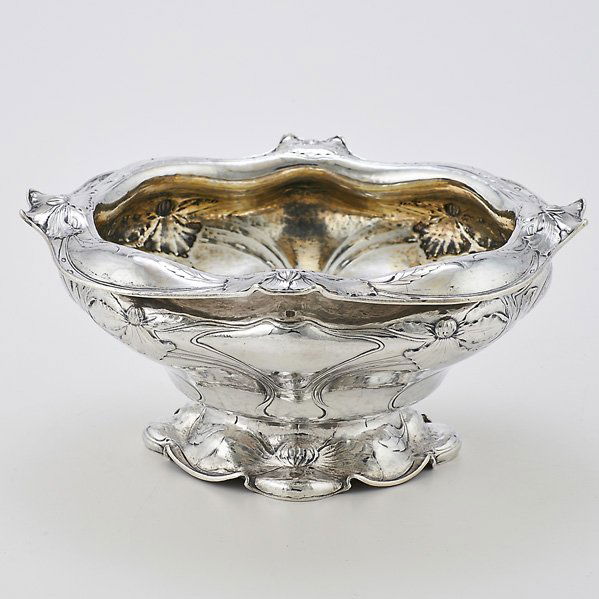 GORHAM MARTELE SILVER CENTER BOWL: Softly billowed form with undulating everted rim, conforming pedestal foot, decorated throughout with broad blossom and whiplash straps, gilt interior, ca. 1900; Type III mark, scratch mark 15EXE; 11