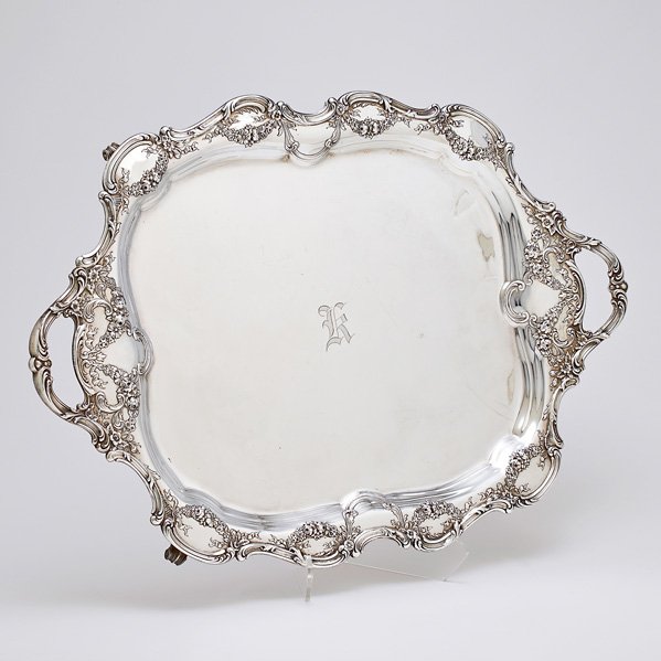 GORHAM EDWARDIAN SILVER TWO-HANDLED WAITER: Undulating scroll rim, handles and feet, chased floral gadroons and ribbon bows, ca. 1910. #A691. Gothic monogram K. 24". 174 OT