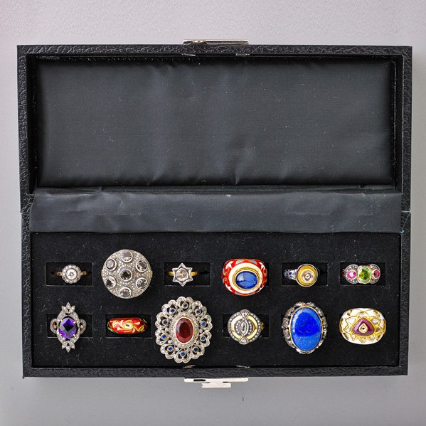 TWELVE GEMSET RINGS, INDIA: Three Jaipur enameled 22k gold rings with foil-backed Kundan set diamonds or colored gems, resinous interiors; Seven silver-topped gold rings with diamonds include tourmaline, zircon, lapis, amethyst,