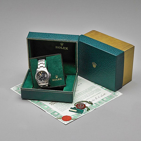 ROLEX REF. 1655 STEVE MCQUEEN STEEL WRISTWATCH: Oyster chronometer perpetual date, Explorer #7429179 marked on case, sold Aug. 1983. Center second, self-winding, black face with large orange hour hand, 24 hour bezel, Cal: 1570, 26 jewels, 5 positio