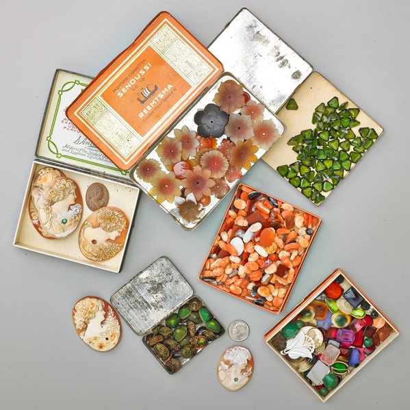 UNUSUALLY INTERESTING GEMSTONE AND JEWELRY LOT: Including but not limited to: 135+ cts. triangular green tourmalines; 75+ cts. calibrated cut tourmalines; 38+ cts. sapphires and rubies; Topaz; 486 cts. coral, conch or hardstone cameos; 7 shell or l