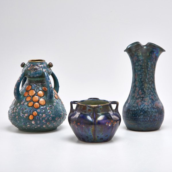 AMPHORA; STELLMACHER CO.; PAUL DACHSEL: Amphora Secessionist vase in mottled iridescent glaze; Stellmacher Co. four-handled blue bowl; Paul Dachsel four-handled vase decorated with grapes; Turn-Teplitz, Bohemia, 1905-1912: All marked; Talle