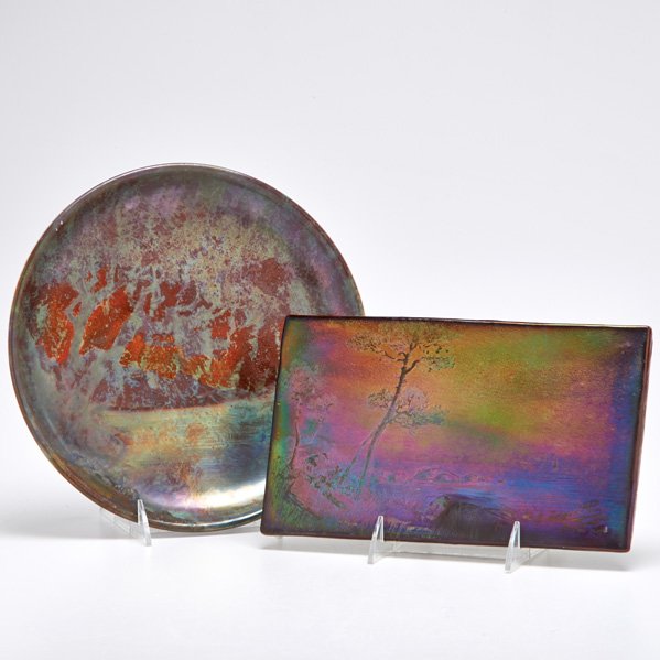 CLEMENT MASSIER; JEAN BAPTISTE GAZIELLO: Iridescent plate and plaque, both painted with landscapes, France, early 20th c.; Massier marked on reverse and Gaziello with paper label; Plate: 10 1/4" dia.