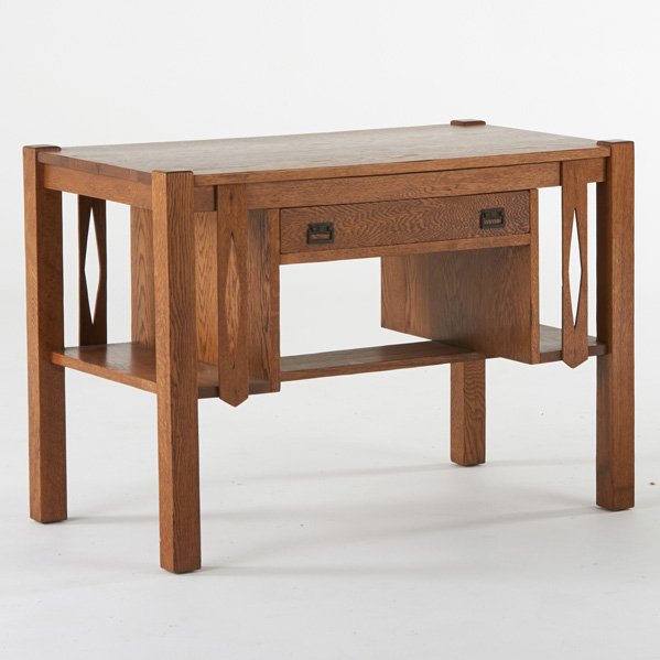 ARTS AND CRAFTS: Single drawer desk with integrated bookshelves, USA, ca. 1915; Quartersawn oak, patinated hardware; 30 1/2" x 42 1/2" x 24"