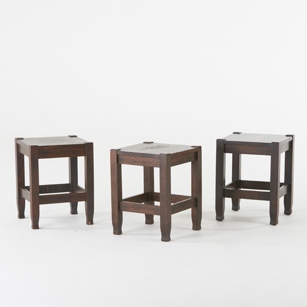 STICKLEY BROTHERS: Three quartersawn oak tabourets with shaped feet, USA, ca. 1910; One with metal "Quaint" tag, one with paper label; Each: 18 1/4" x 14" sq.