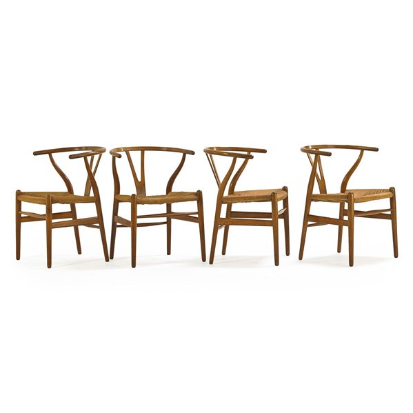 HANS WEGNER; CARL HANSEN: Set of four Wishbone chairs, Denmark, 1960s; Oak, woven paper cord; Unmarked; 28 1/2" x 21 1/4" x 20"