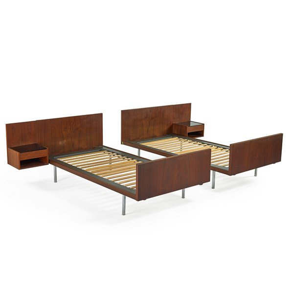 HANS WEGNER; GETAMA: Two twin bed frames with built-in nighstands, Denmark, 1960s; Teak, matte-chromed steel, black glass; Branded; Overall: 29 1/2" x 56" x 81 1/2" ea., inside: 78 1/2" x 39 1/2"