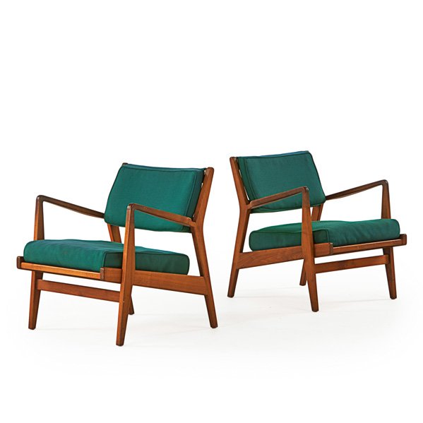 JENS RISOM DESIGN: Pair of lounge chairs with arms, USA, 1960s; Walnut, upholstery; Remnants of manufacturer labels; 30" x 27" x 33"