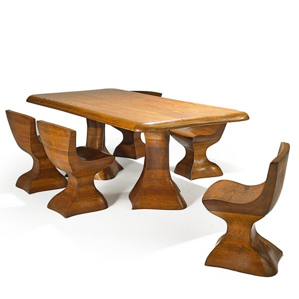AMERICAN STUDIO: Dining table and five chairs, USA, 1980s; Laminated and carved oak; Unmarked; Chairs: 28 1/2" x 22 1/2" x 18", table: 31" x 43 1/2" x 83 1/2"