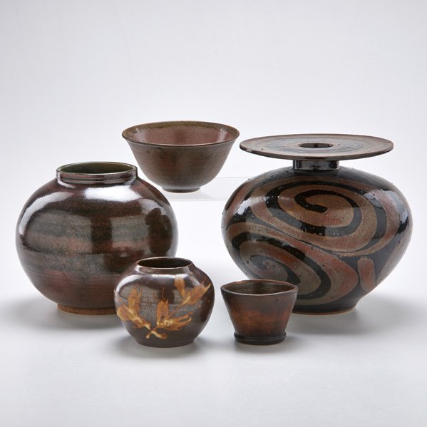 NORMAN ELWYN ARSENAULT; ETC.: Four stoneware pieces and one ceramic piece: Arsenault stoneware vase with swirl motif and small stoneware vase with abstract leaf motif; F. Carlton Ball stoneware spherical vase; James and Nan McKinn