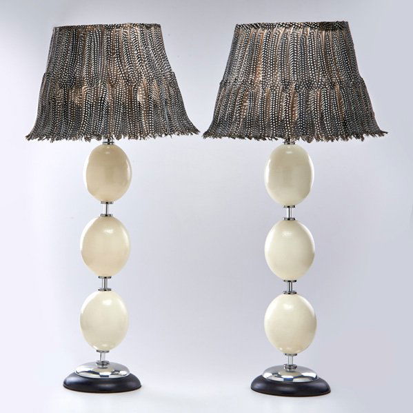 MAITLAND SMITH: Pair of table lamps decorated with ostrich eggs, topped with feather lampshades, USA, 20th c.; Chromed steel, ebonized wood; Both unmarked; Lamp bases: 27" x 8" dia.