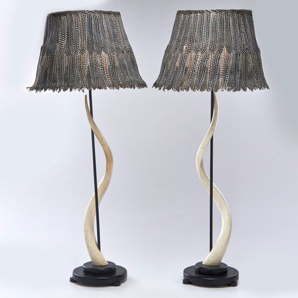 MAITLAND SMITH: Pair of antelope horn table lamps with ebonized metal fittings and wooden bases, topped with feather lampshades, USA, second half 20th c.; All unmarked; Lamp bases: 30" x 8" dia.