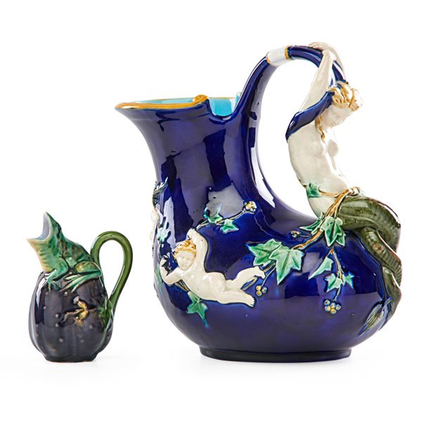 MINTON Two majolica pitchers: MINTON Two majolica pitchers, larger carved with Daphne, smaller with frog on eggplant, England, 1851/1874; Larger stamped MINTON/ 1420/D/artist's cipher/date code, smaller stamped with numbers/MINTON
