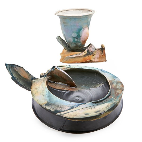 SUSANNE STEPHENSON Two pieces: SUSANNE STEPHENSON (b. 1935) Glazed porcelain sculptural bowl and stoneware chalice, Ann Arbor, MI, 1970s; Chalice signed SAS/T-L; 5 1/2" x 17" x 12", 7 1/2" x 7 " x 5 1/2"