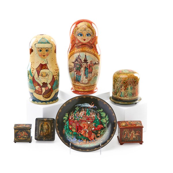 RUSSIAN PALEKH LACQUER: Seven items, late 20th c.: two nesting dolls, small porcelain plate and four small boxes; Largest doll: 9 3/4"