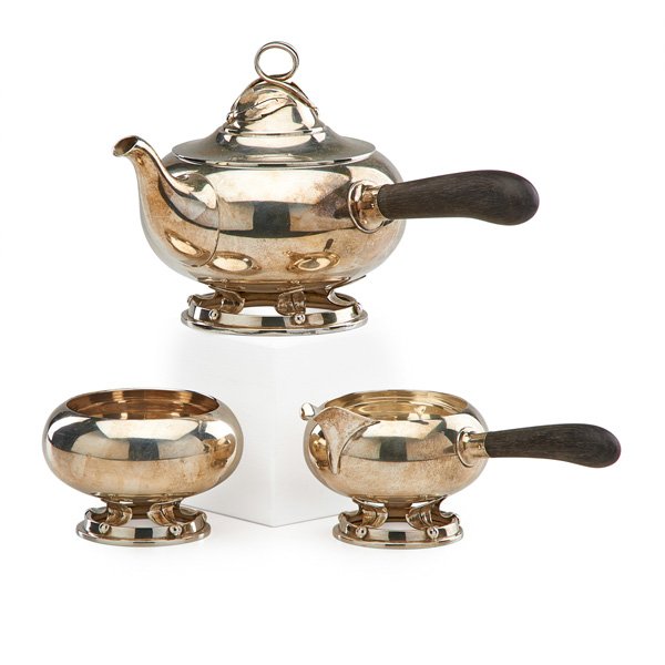 ALLAN ADLER STERLING SILVER TEA SERVICE: Three pieces, 20th c.: covered teapot, sugar and creamer; Stamped Allan Adler Handmade Sterling; 45 OT (includes handles), teapot: 6 1/4" x 10"