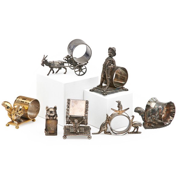 SILVER PLATE NAPKIN RINGS: Seven, 19th/20th c.: one decorated with young boy, others with various animals and birds; Boy: 4 1/2"