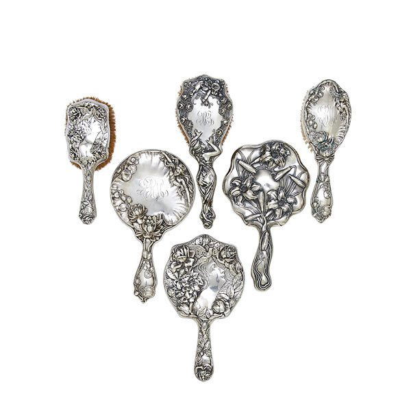 ART NOUVEAU STERLING BRUSHES AND MIRRORS: Six items, early 20th c.: Unger Brothers hand mirror, Simon Brothers hand mirror and brush, F& B hand mirror and brush and brush by unidentified maker; Largest: 10"