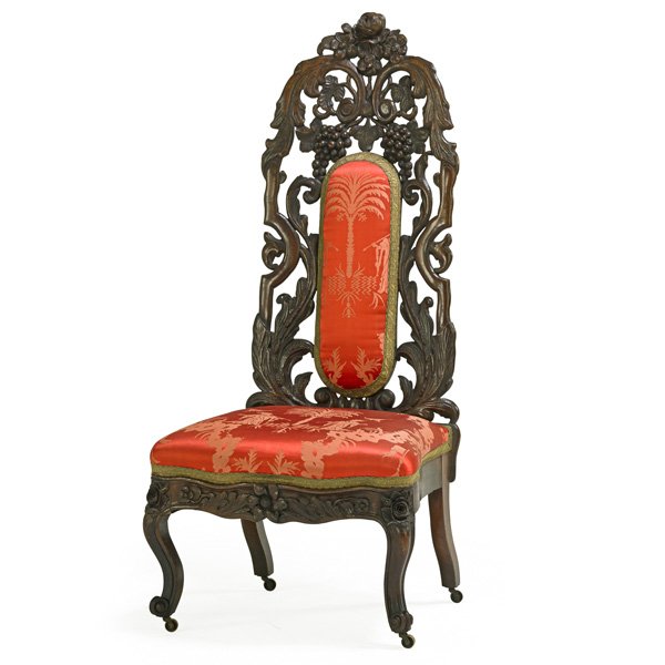 BELTER VICTORIAN SLIPPER CHAIR: Laminated rosewood frame with padded seat, pierced backrest carved with grapevines, cabriole legs ending with casters, ca. 1860; 43" x 19 1/2" x 18 1/2"