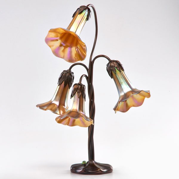 STYLE OF TIFFANY STUDIOS: Contemporary adjustable four-light lily lamp with iridescent glass shades; Patinated metal; Unmarked: As shown: 21 1/2" x 14" dia.
