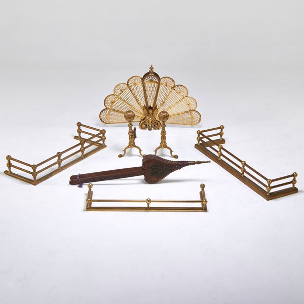 FIREPLACE ACCESSORIES: Three fenders, set of andirons, bellows, and fan design fire screen, early 20th c.; Brass, cast iron, carved wood, leather; All unmarked; Tallest: 45 1/2"