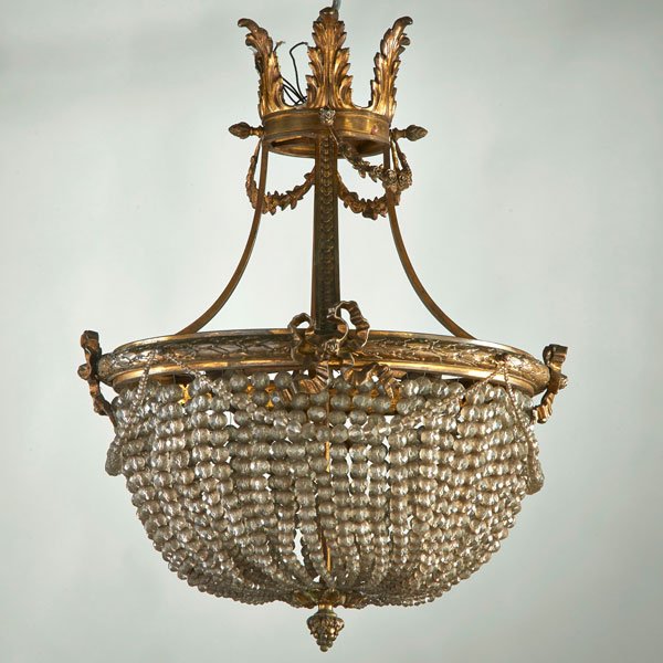 DECORATIVE LIGHTING: Bronze and crystal Rococo chandelier with leaf and bow decoration, 19th c.; Unmarked; 25" x 17 1/2" dia.