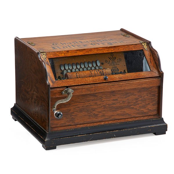 CHAUTAUQUA ROLLER ORGAN: Oak case, two rolls, late 19th c.; 12 1/2" x 18" x 18"