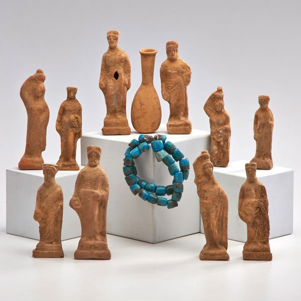 EGYPTIAN USHABTI, ETC.: Twelve pieces: eleven terra cotta figures or phylactery vials, together with turquoise dyed faience bracelet; Tallest: 6 1/2"