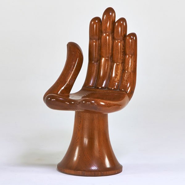 STYLE OF PEDRO FRIEDEBERG: Hand chair, 1960s; Carved and laminated oak; Unmarked; 35 1/2" x 19" x 21 1/2"