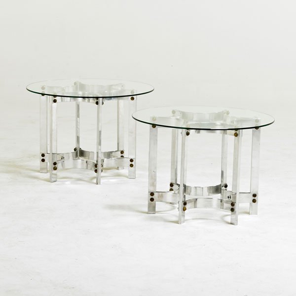 STYLE OF JOHN VESEY: Pair of occasional tables, USA, 1970s; Polished aluminum, glass, brass; Unmarked; 15 1/2" x 22" dia.