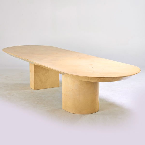 KARL SPRINGER: Racetrack dining table on pair of semi-circular pedestals, New York, 1980s; Lacquered parchment; Remnants of paper label; 29" x 144" x 48"