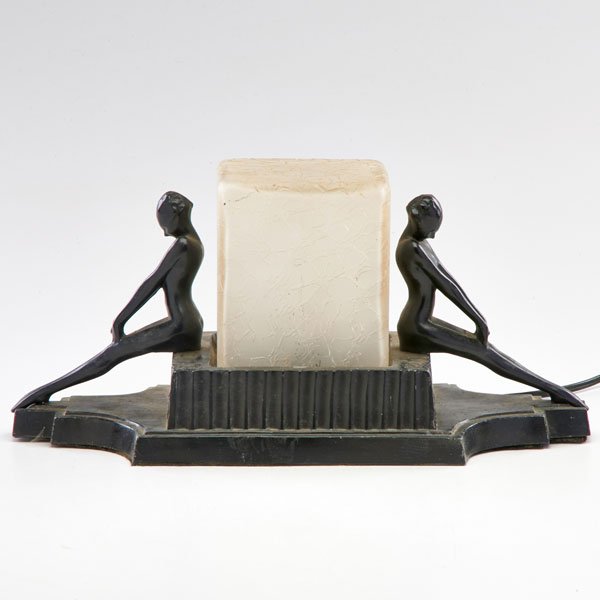 FRANKART: Figural desk lamp with two seated women, New York, 1920s; Ebonized metal, frosted glass; Unmarked; 7 1/2" x 14" x 6 1/4"