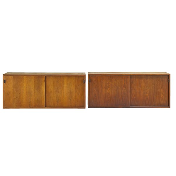 FLORENCE KNOLL: Pair of wall-hanging cabinets, New York, 1960s; Walnut, oak, leather; Manufacturer's labels; 20" x 48" x 17 3/4"