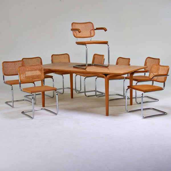 MARCEL BREUER; BILL STEPHENS; KNOLL INTERNATIONAL: Nine Cesca chairs; Together with Bill Stephens dining table with two leaves, 1970s; Oak, woven cane, chromed steel; Manufacturer labels; Table: 29" x 76" x 40", two 19" leaves, chairs:31" x 22 1/2" x