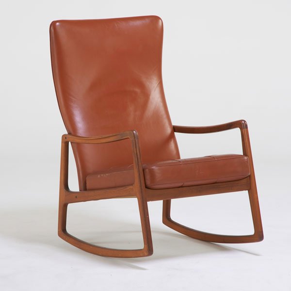 OLE WANSCHER: Tall back rocking chair, Denmark, 1960s; Sculpted teak, leather; Unmarked; 40" x 26 1/2" x 34"